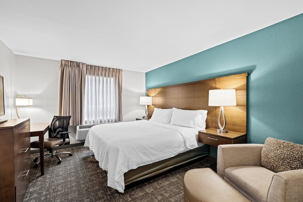 Premium bedding, desk, laptop workspace, blackout curtains
