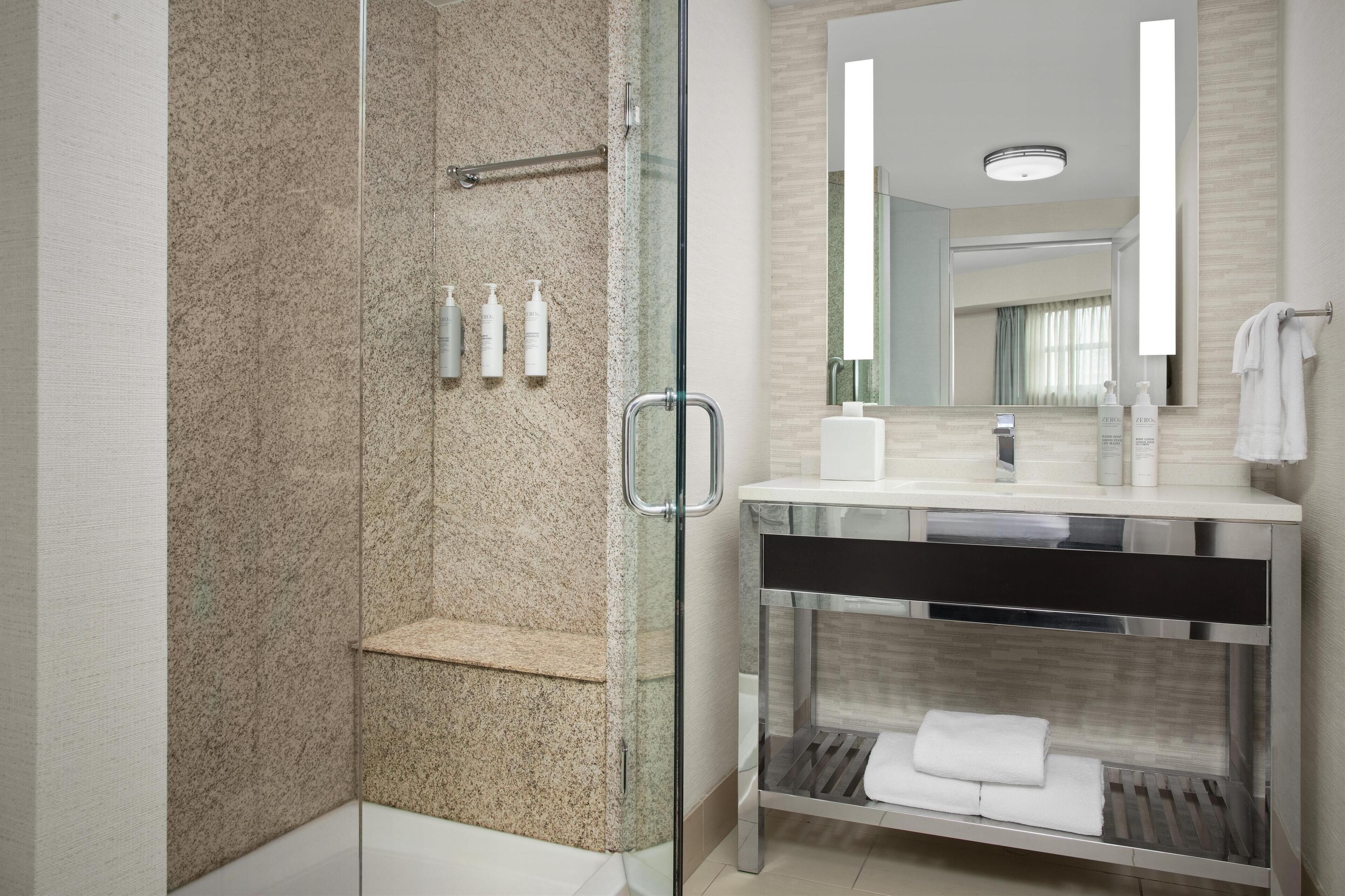 suite, 1 king bed (mini fridge/microwave) | bathroom | free toiletries, hair dryer, towels