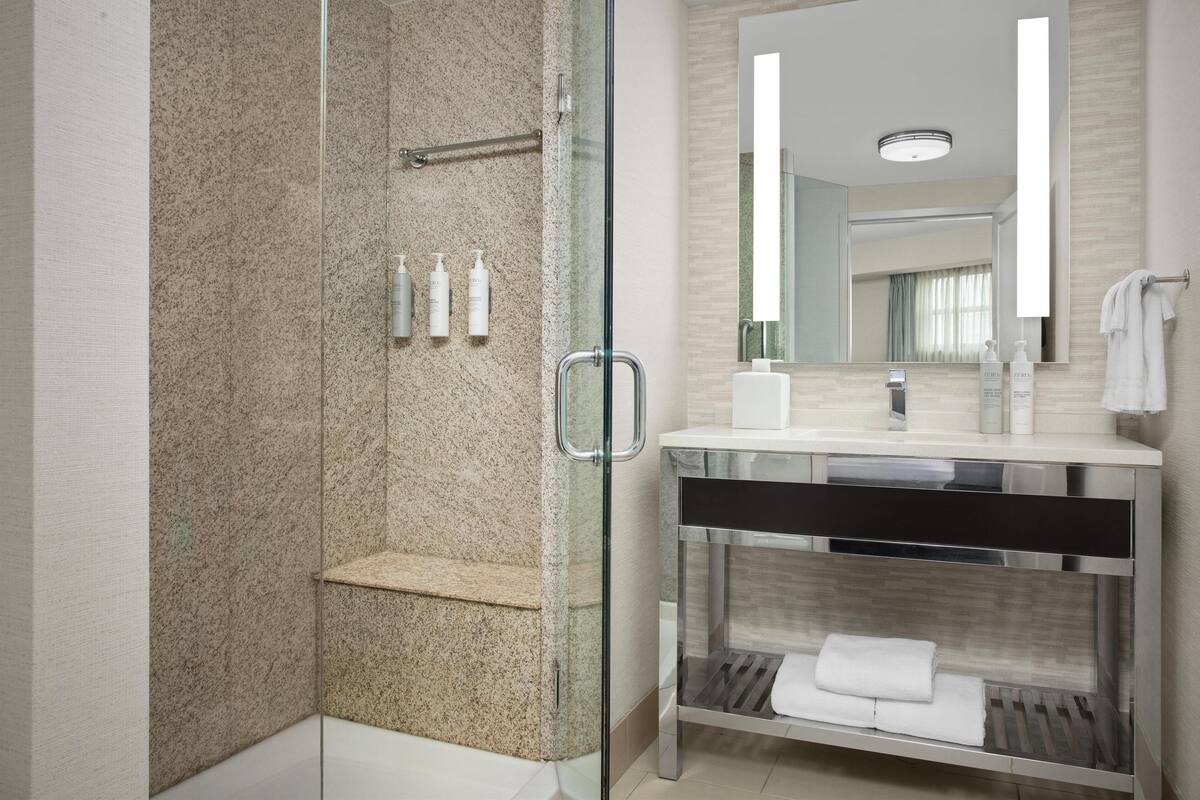 suite, 1 king bed (mini fridge/microwave) | bathroom | free toiletries, hair dryer, towels