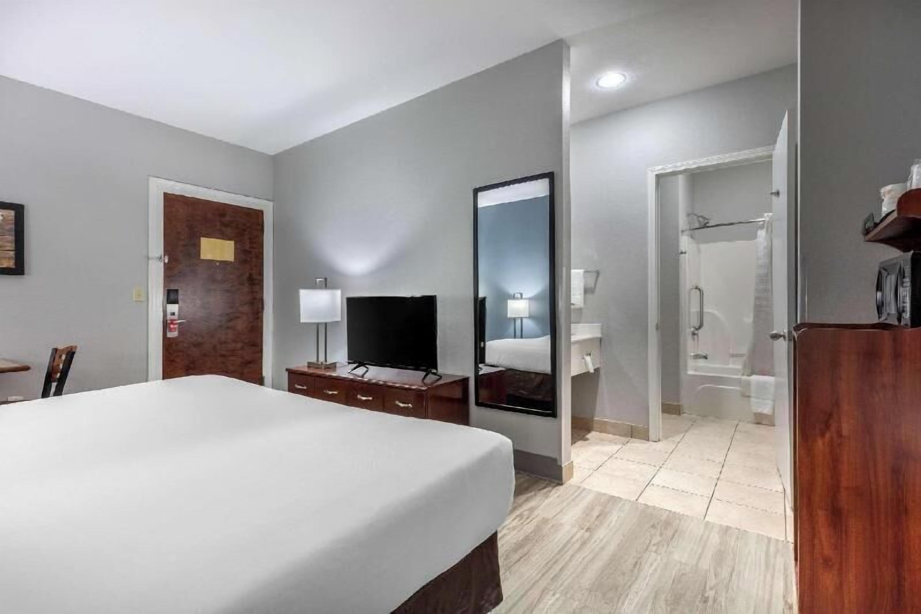 Desk, laptop workspace, blackout curtains, iron/ironing board