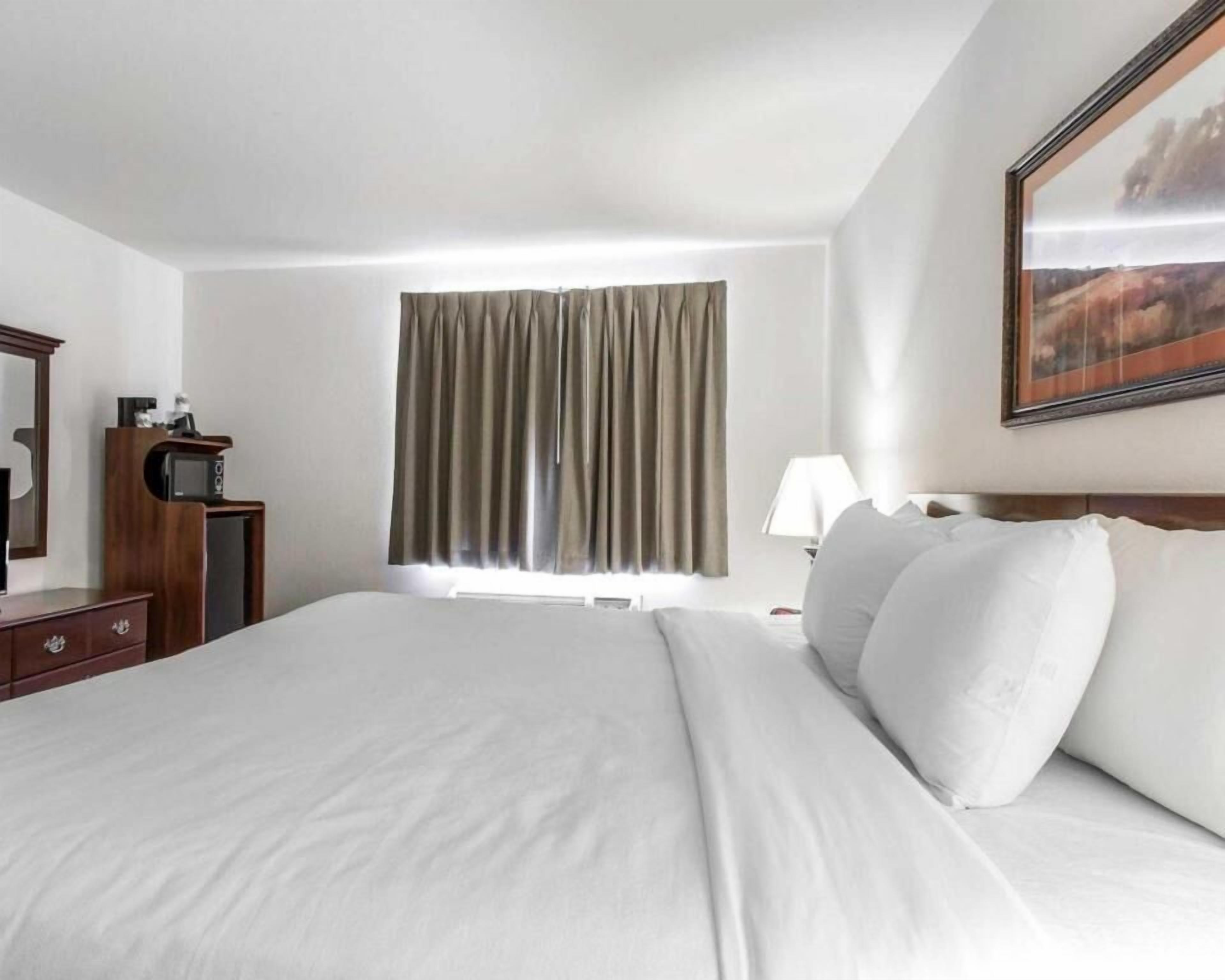 Desk, laptop workspace, blackout curtains, iron/ironing board