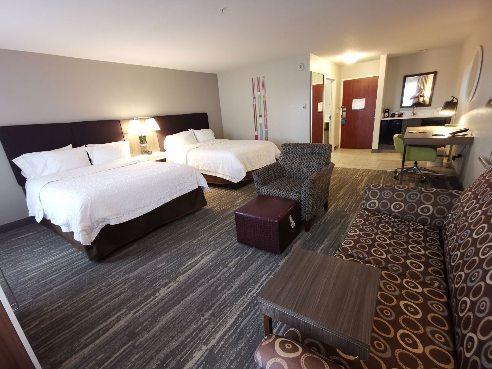 Premium bedding, down comforters, pillowtop beds, in-room safe