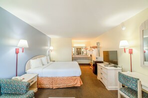 A hotel room with a bed, desk, chair, and a television. - Shale Inn Andrews (Andrews)