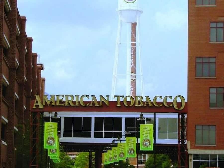 The American Tobacco building with a prominent tower and a sign reading "Lucky Strike".