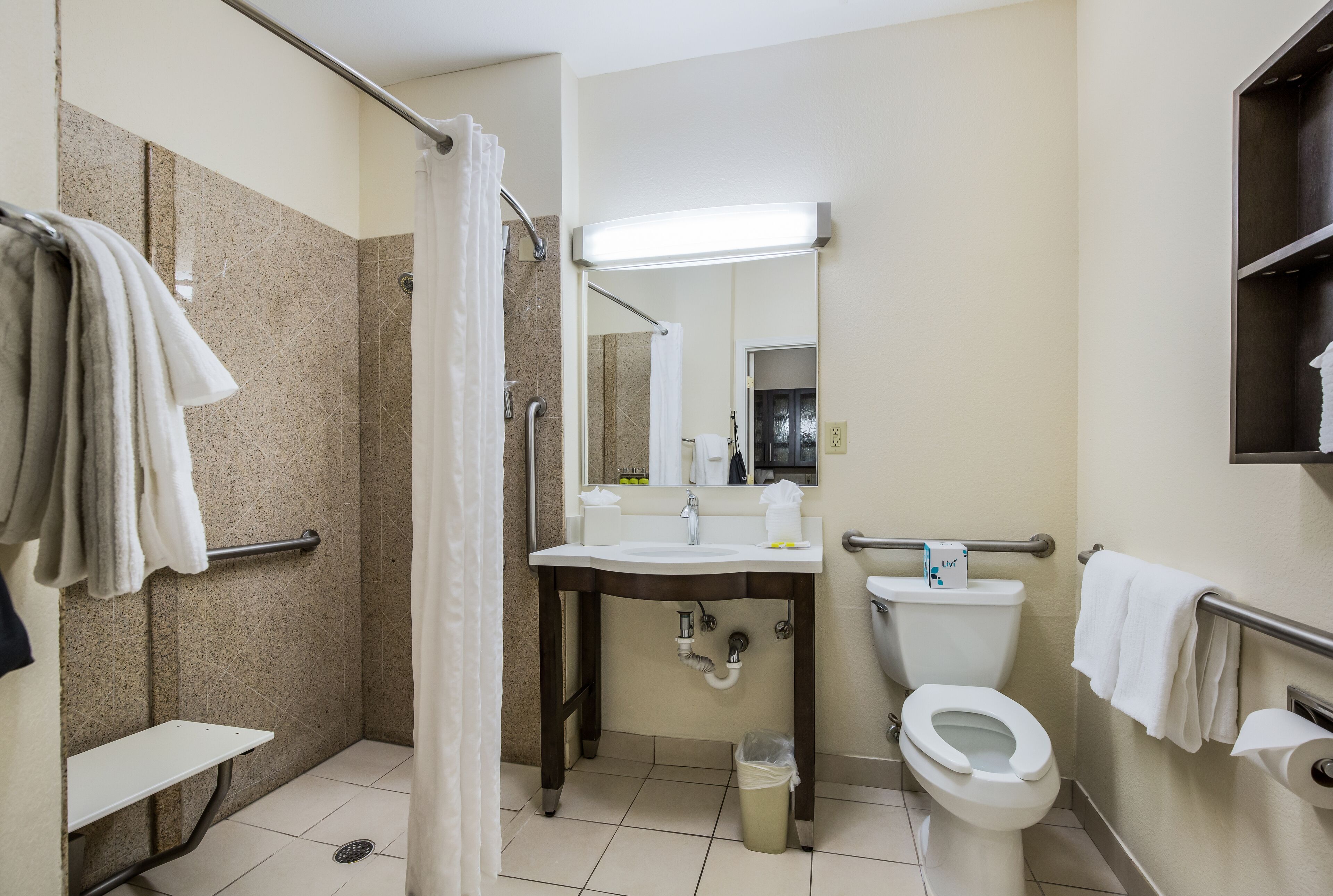 combined shower/bathtub, hair dryer, towels, soap