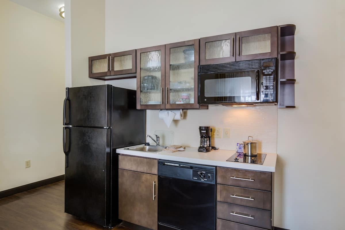 fridge, microwave, coffee/tea maker, cookware/dishes/utensils