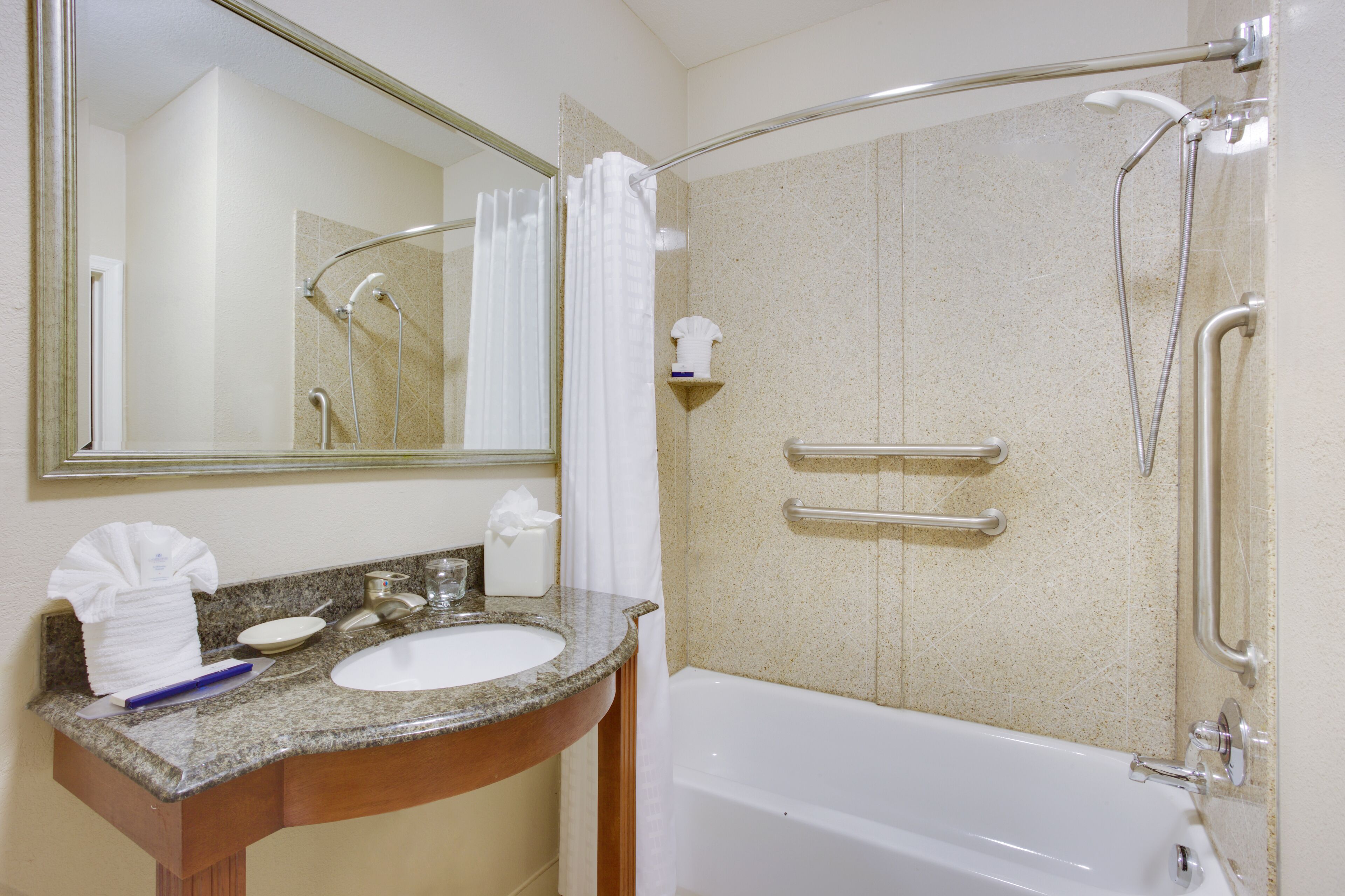 combined shower/bathtub, hair dryer, towels, soap