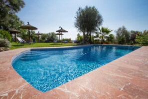 Seasonal outdoor pool, pool umbrellas, pool loungers