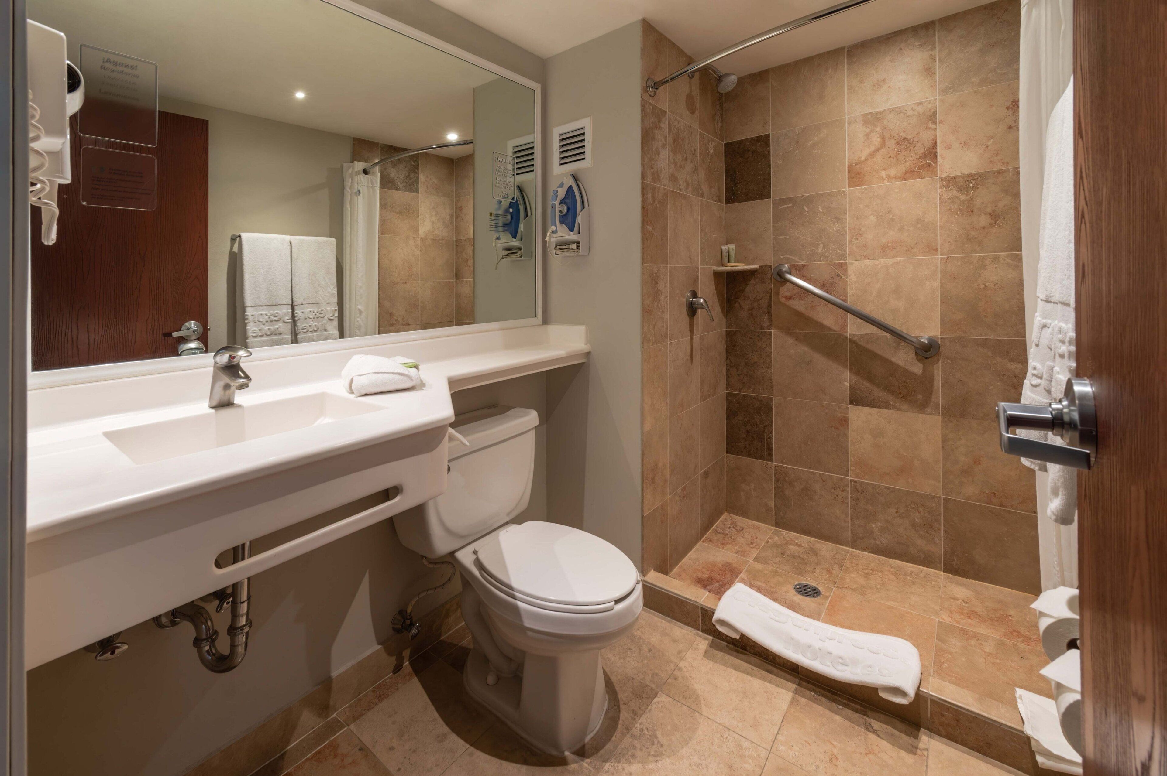 shower, rainfall showerhead, hair dryer, towels