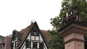 A traditional half-timbered building with a sign for the Ritter Hotel Bar. - Ritter Hotel (Frankfurt)