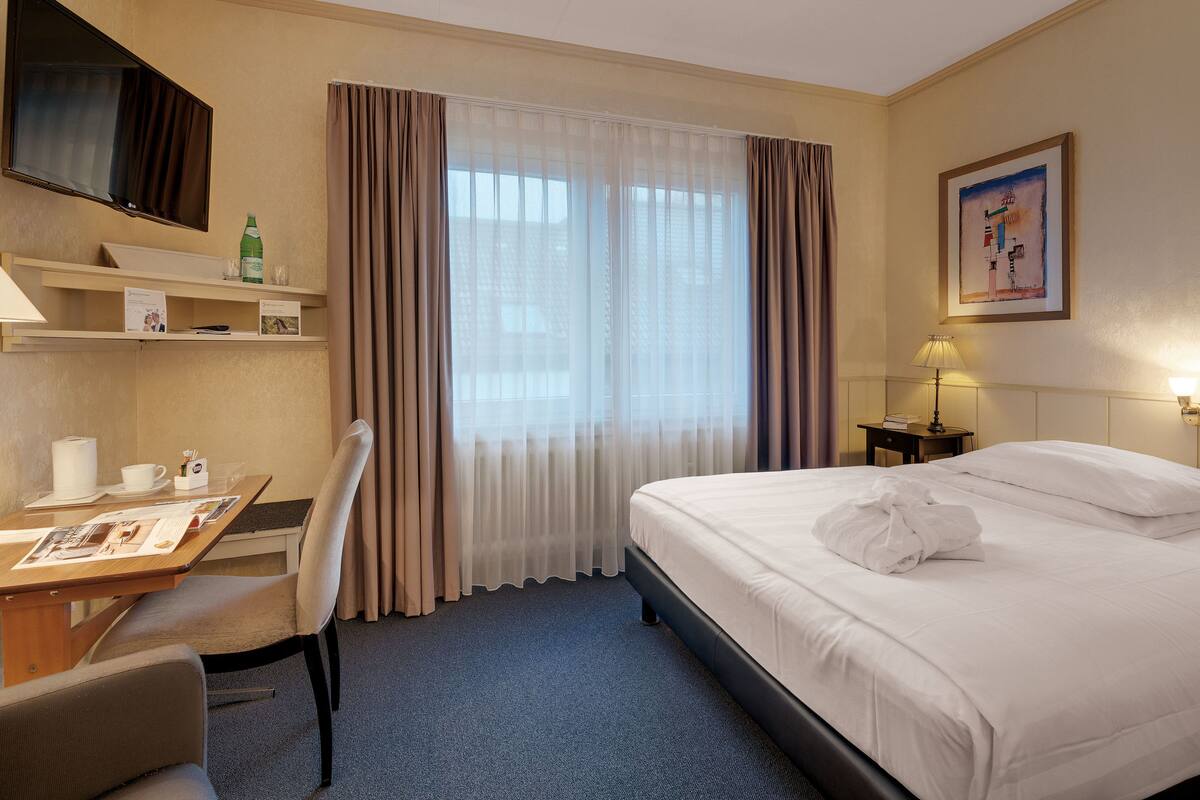 Standaard eenpersoonskamer | Hypoallergeen beddengoed, een kluis op de kamer, een bureau