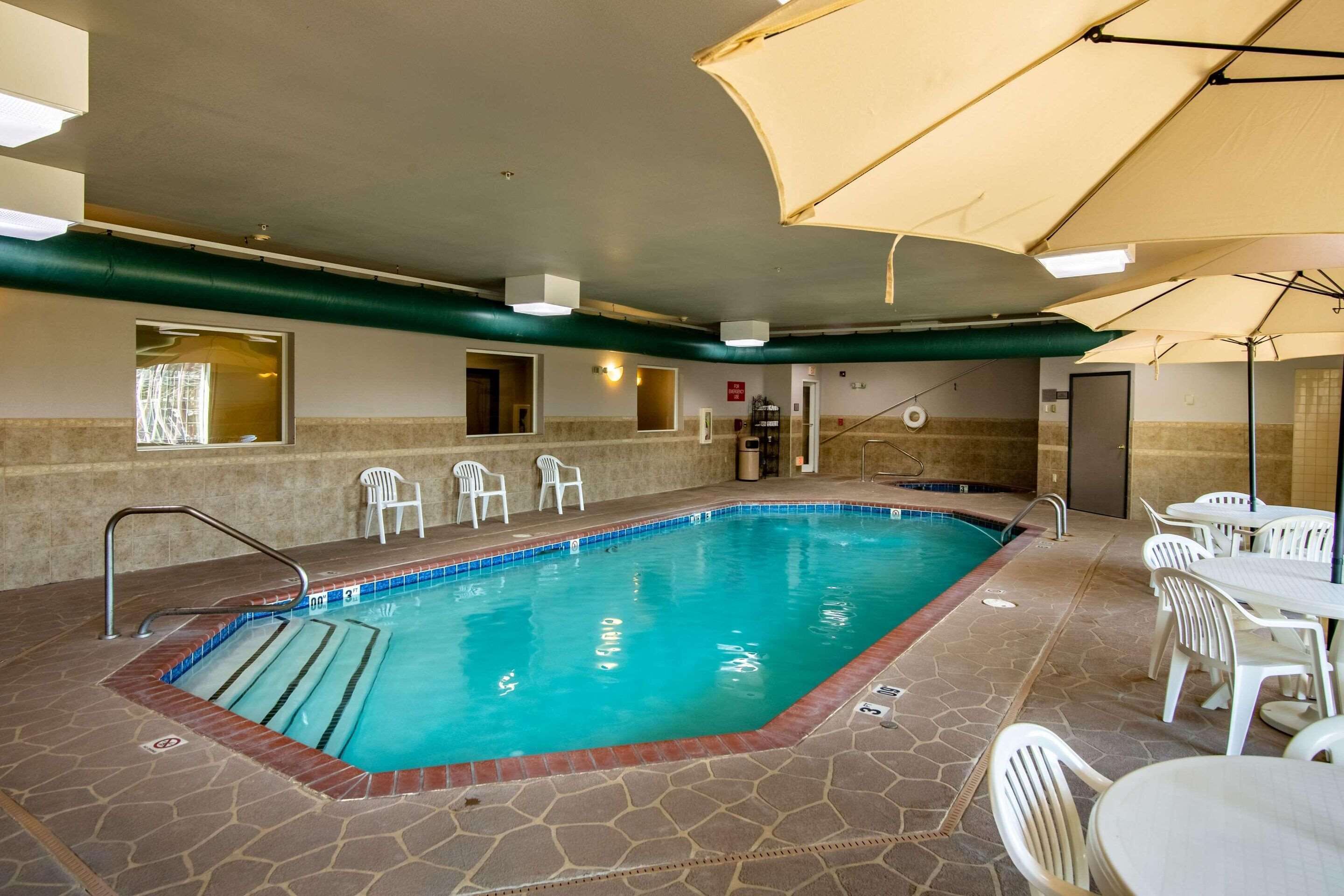 indoor pool, pool umbrellas, pool loungers