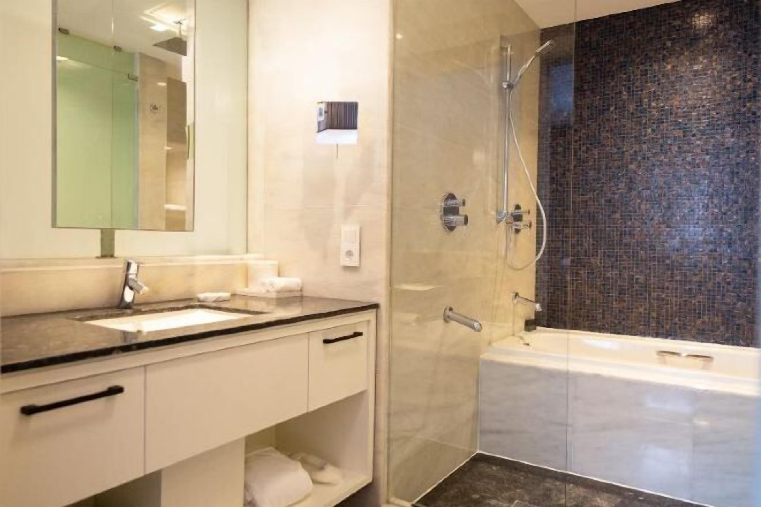 Bathroom | Eco-friendly toiletries, hair dryer, bathrobes, slippers