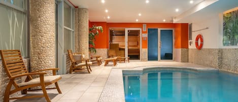 Indoor pool, open 9:00 AM to 9:00 PM, pool loungers