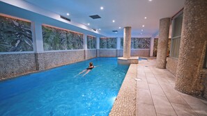 Indoor pool, open 9:00 AM to 9:00 PM, pool loungers