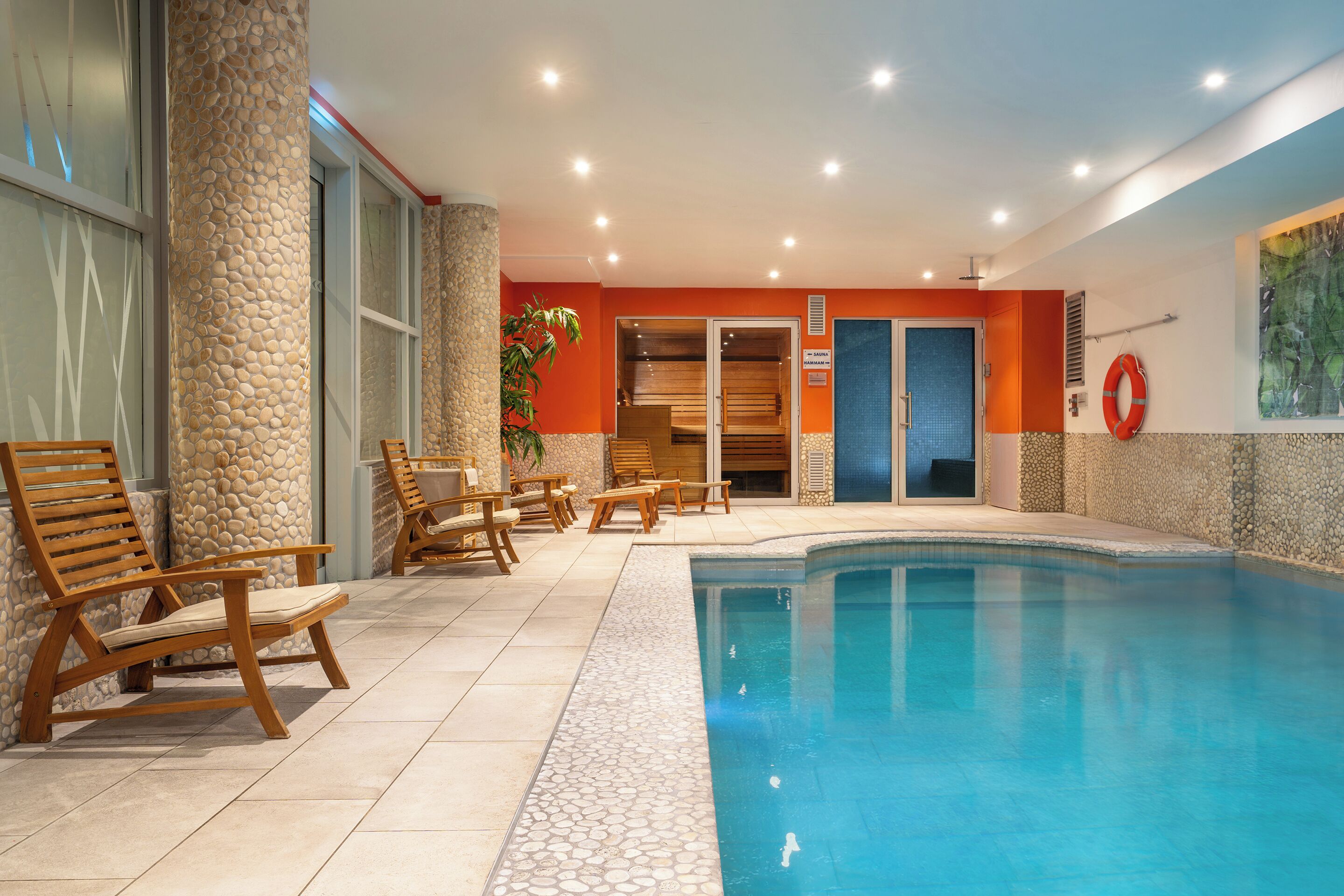 Indoor pool, open 9:00 AM to 9:00 PM, pool loungers