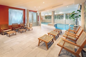 Indoor pool, open 9:00 AM to 9:00 PM, pool loungers