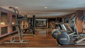 A gym with treadmills, elliptical machines, and weight equipment. - Hotel Evian-les-Bains by Leonardo Hotels (Evian-les-Bains)
