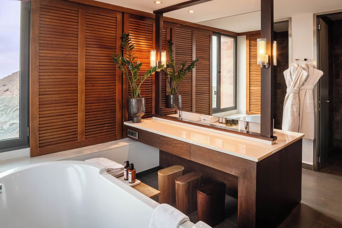 eco-friendly toiletries, hair dryer, bathrobes, slippers