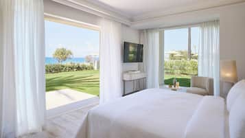 Deluxe Suite Sea Front Palm Gardens | Minibar, in-room safe, desk, laptop workspace