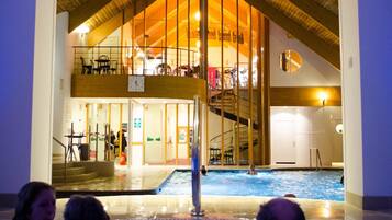 Relax by the pool surrounded by a glass enclosure and enjoy the unique starlight ceiling.