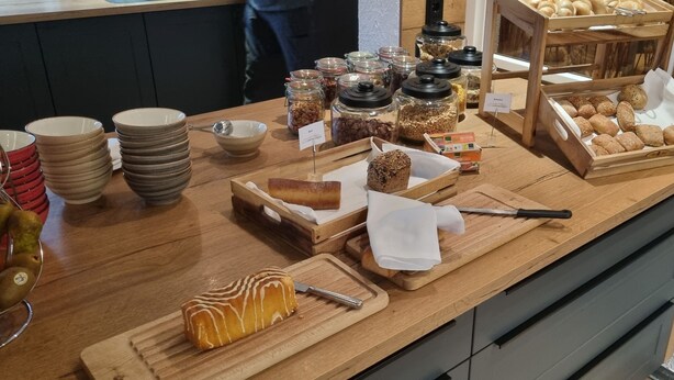 A breakfast buffet with various food items and utensils. - Hotel Empfinger Hof, Sure Hotel Collection by Best Western (Empfingen)