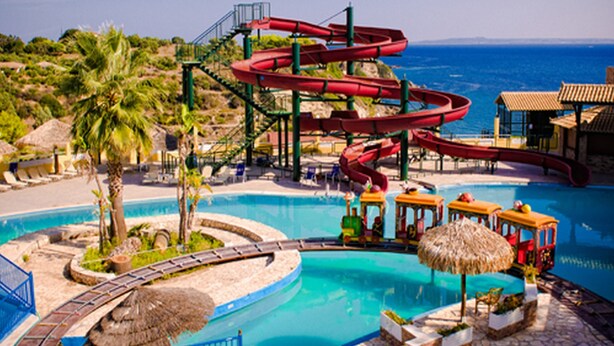 A water park with multiple slides, a pool, and a small train ride. - Palazzo di Zante (Zakynthos)