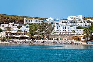 On the beach, sun loungers, beach umbrellas, beach towels
