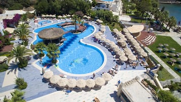 Indoor pool, outdoor pool, pool umbrellas, pool loungers