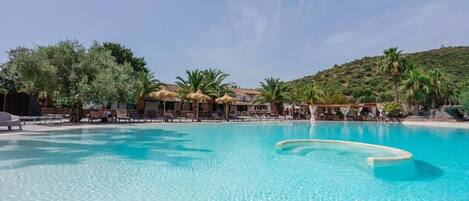 Seasonal outdoor pool, an infinity pool, pool umbrellas, sun loungers