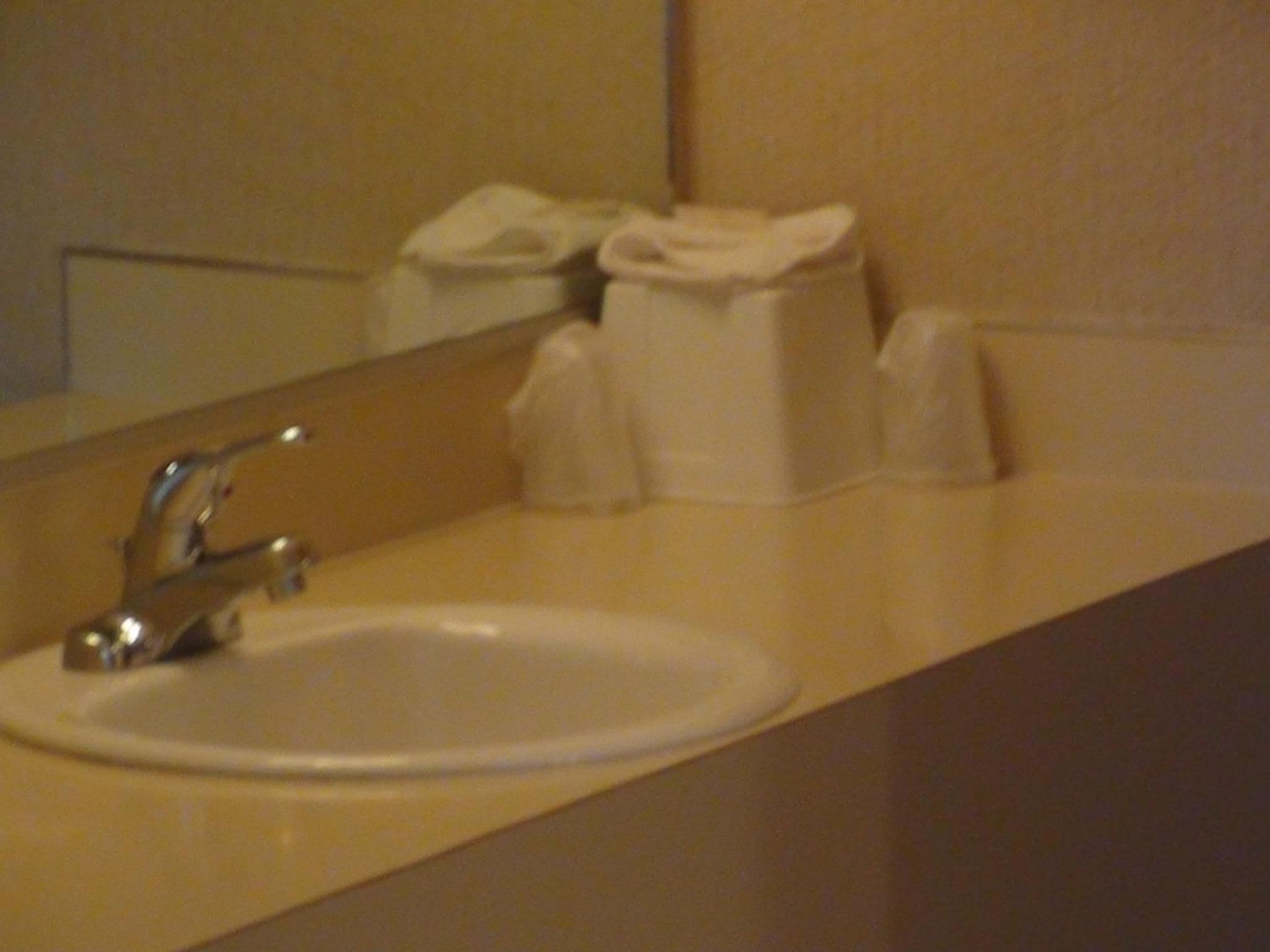 A bathroom sink with a mirror above it.
