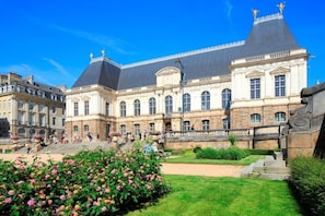 A historic building with a central courtyard, large windows, and a prominent entrance. - Mercure Rennes Cesson (Cesson-Sevigne)