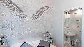 Economy Room | Down duvets, minibar, in-room safe, individually decorated