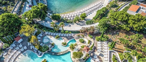 Outdoor pool, open 8 AM to 7 PM, pool umbrellas, sun loungers