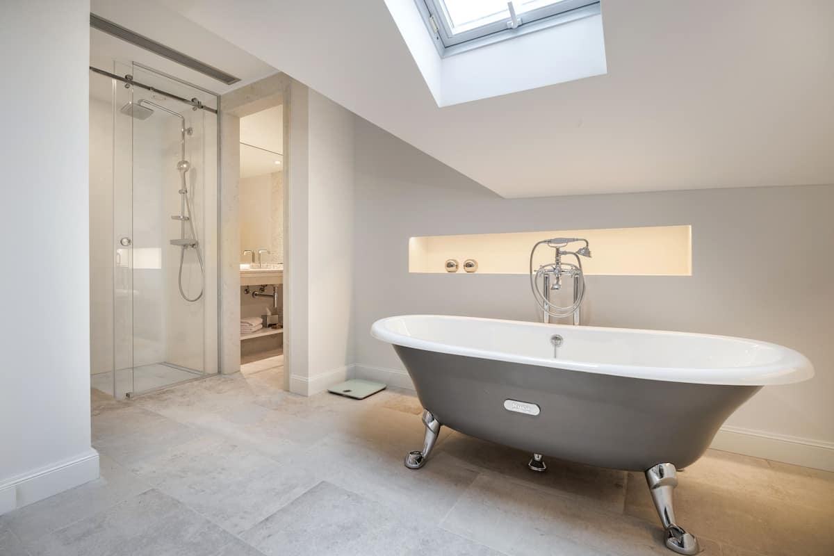 deluxe two bedroom suite | bathroom | free toiletries, hair dryer, bathrobes, slippers