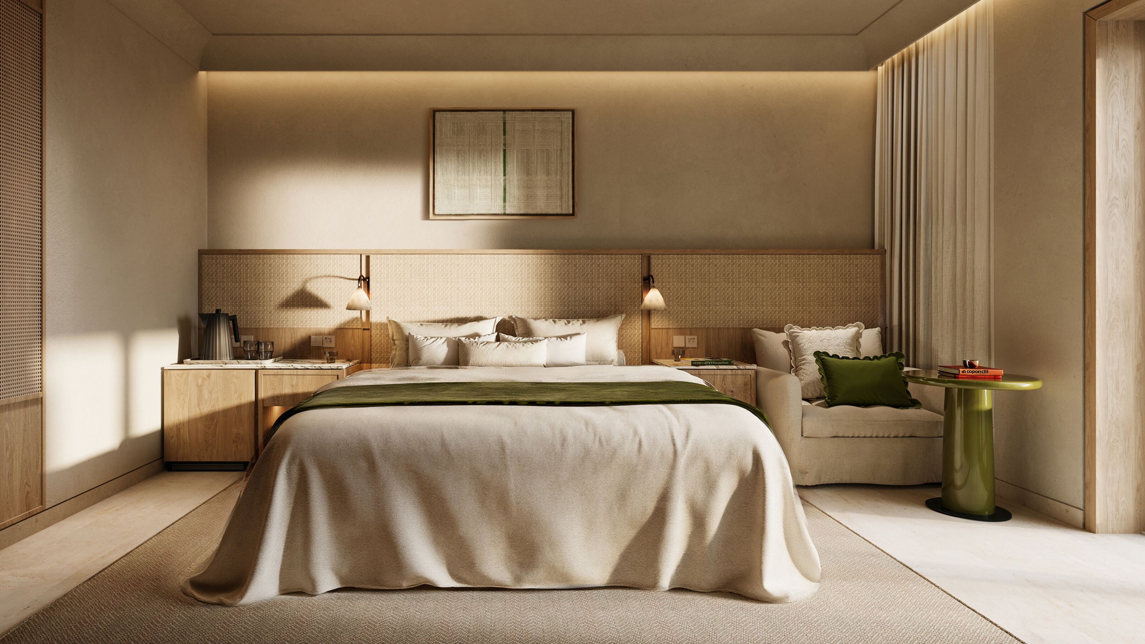 A modern bedroom with a large bed, bedside tables, a nightstand, a reading lamp, a green pillow, and a small side table with books.