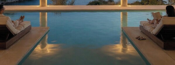 A pool with two lounge chairs on either side, a clear view of the water, and a calm atmosphere. - Sirena Resort Hvar - NEW IN 2026 (Hvar)