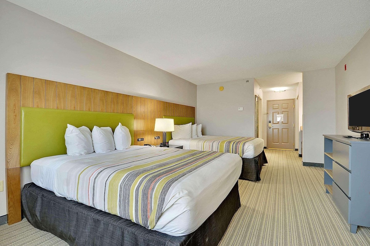 Premium bedding, desk, laptop workspace, blackout curtains