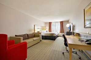 Suite estudio, 1 cama King size, para no fumadores | Área de sala de estar | Televisión LED 