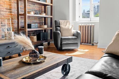 Grand Apartment | Living area | 50-inch flat-screen TV with cable channels, TV, books