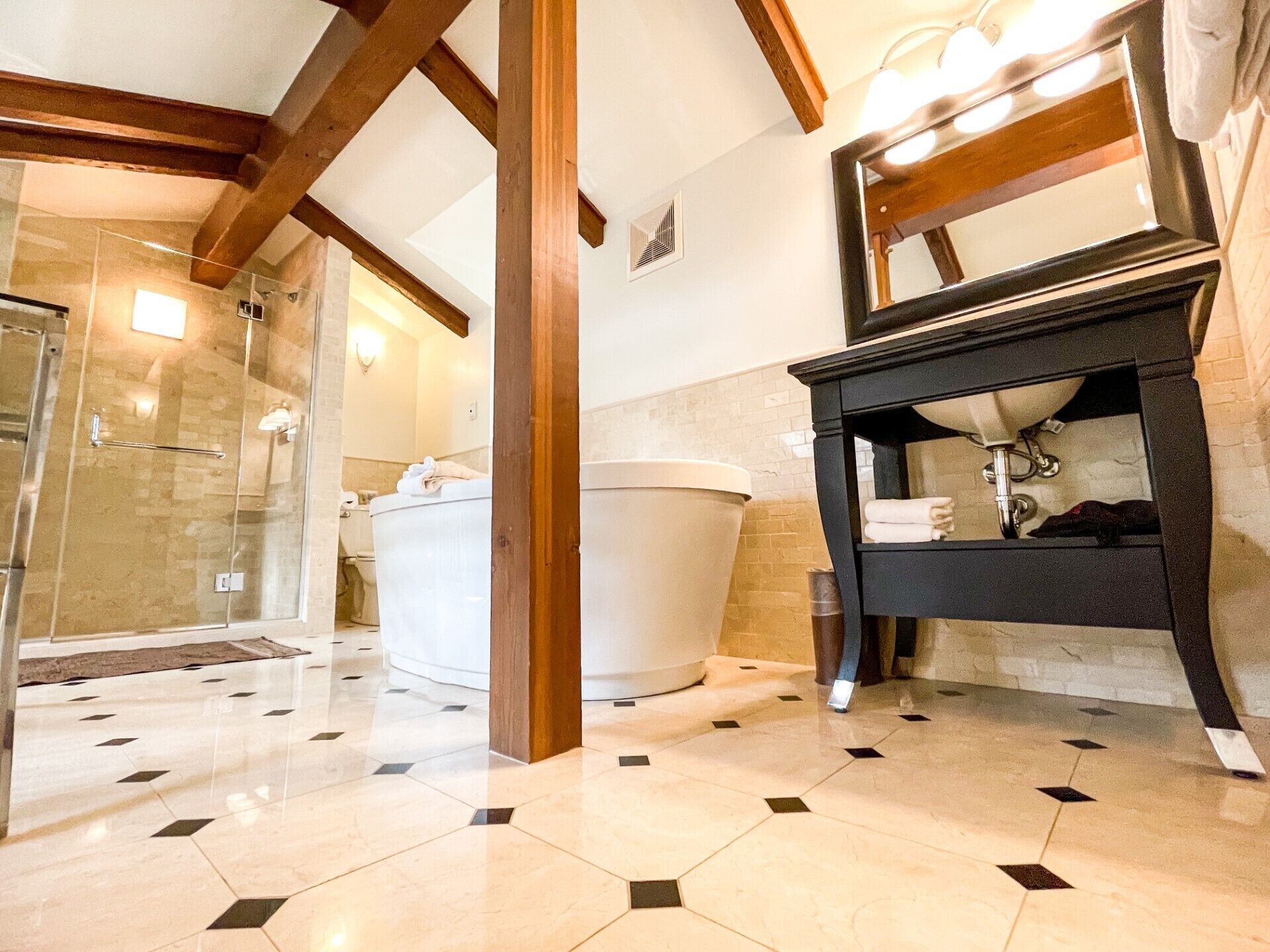 contemporary junior suite (lady godiva & sewell)  | bathroom | free toiletries, hair dryer, towels, soap