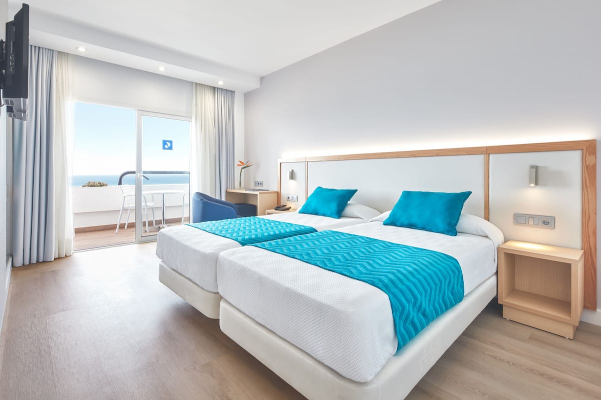 minibar, desk, blackout curtains, iron/ironing board