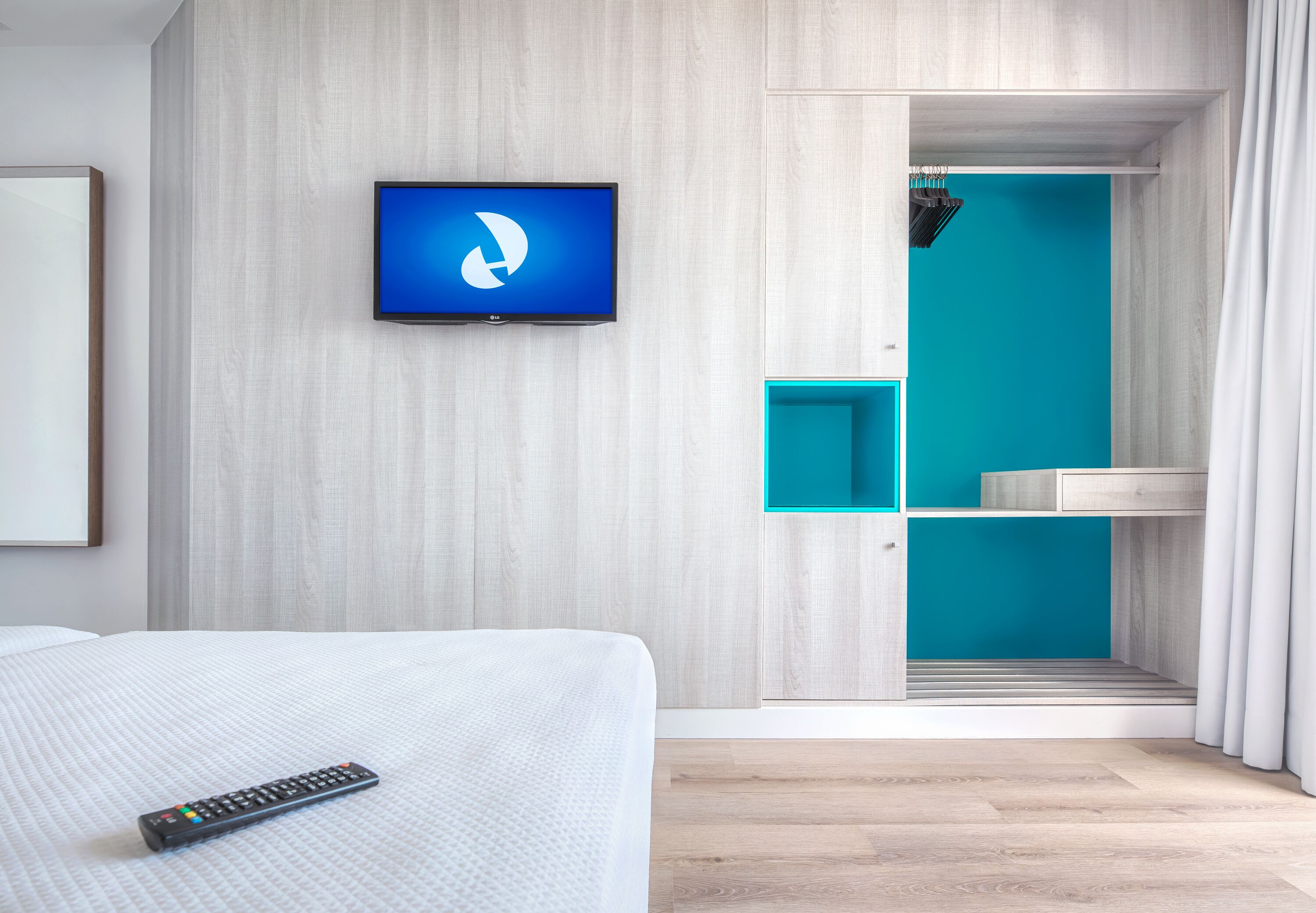 minibar, desk, blackout curtains, iron/ironing board