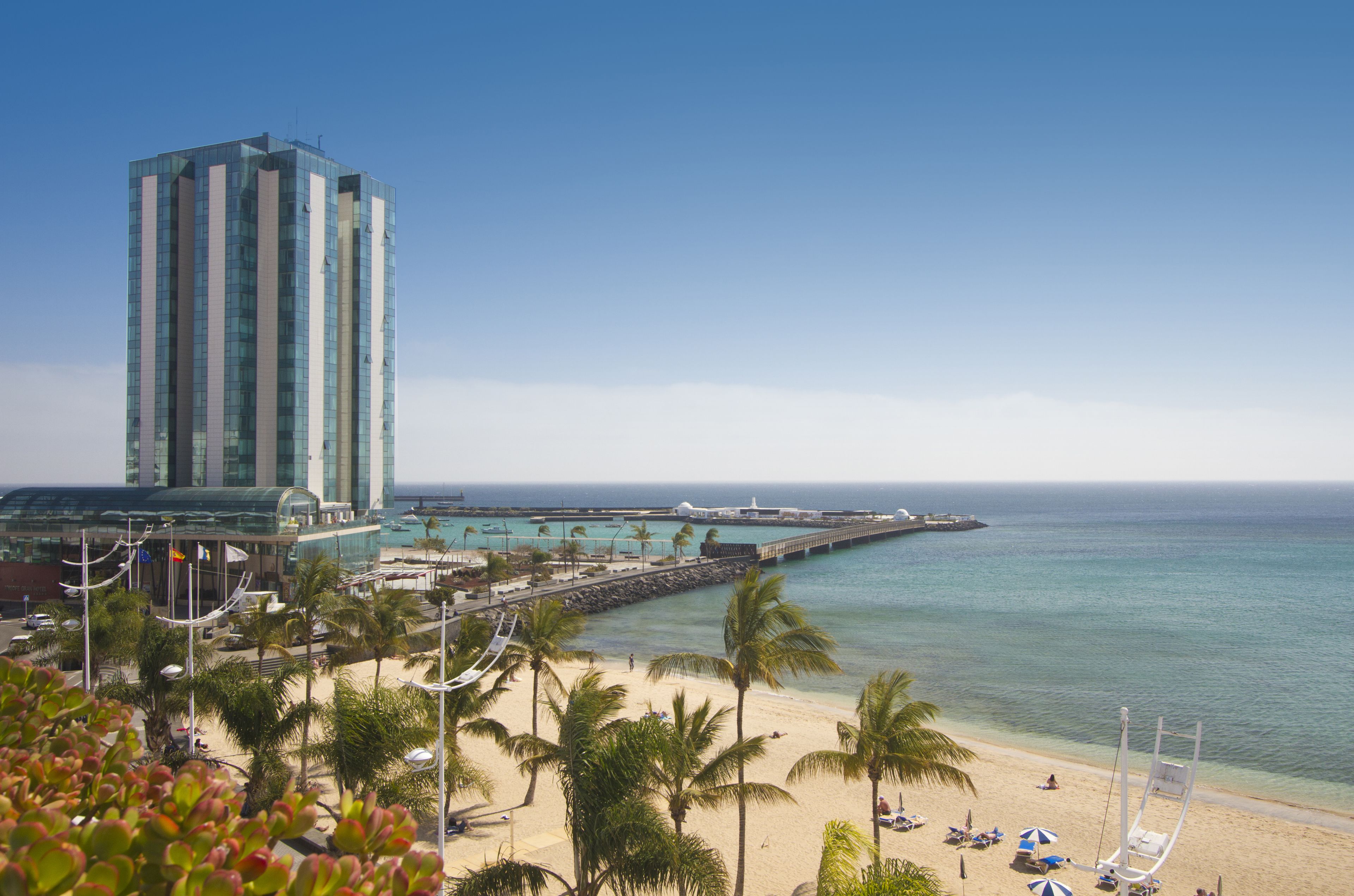 on the beach, white sand, sun-loungers, beach umbrellas