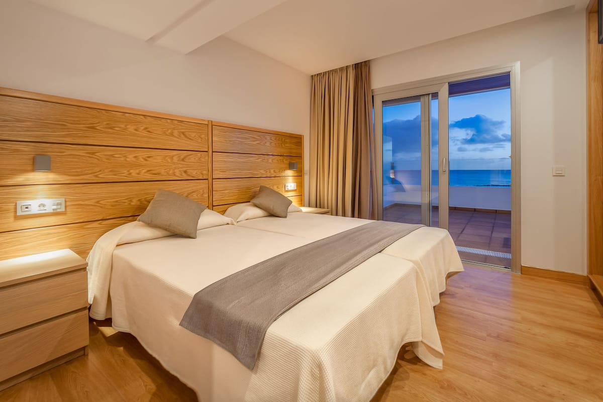 minibar, desk, blackout curtains, iron/ironing board