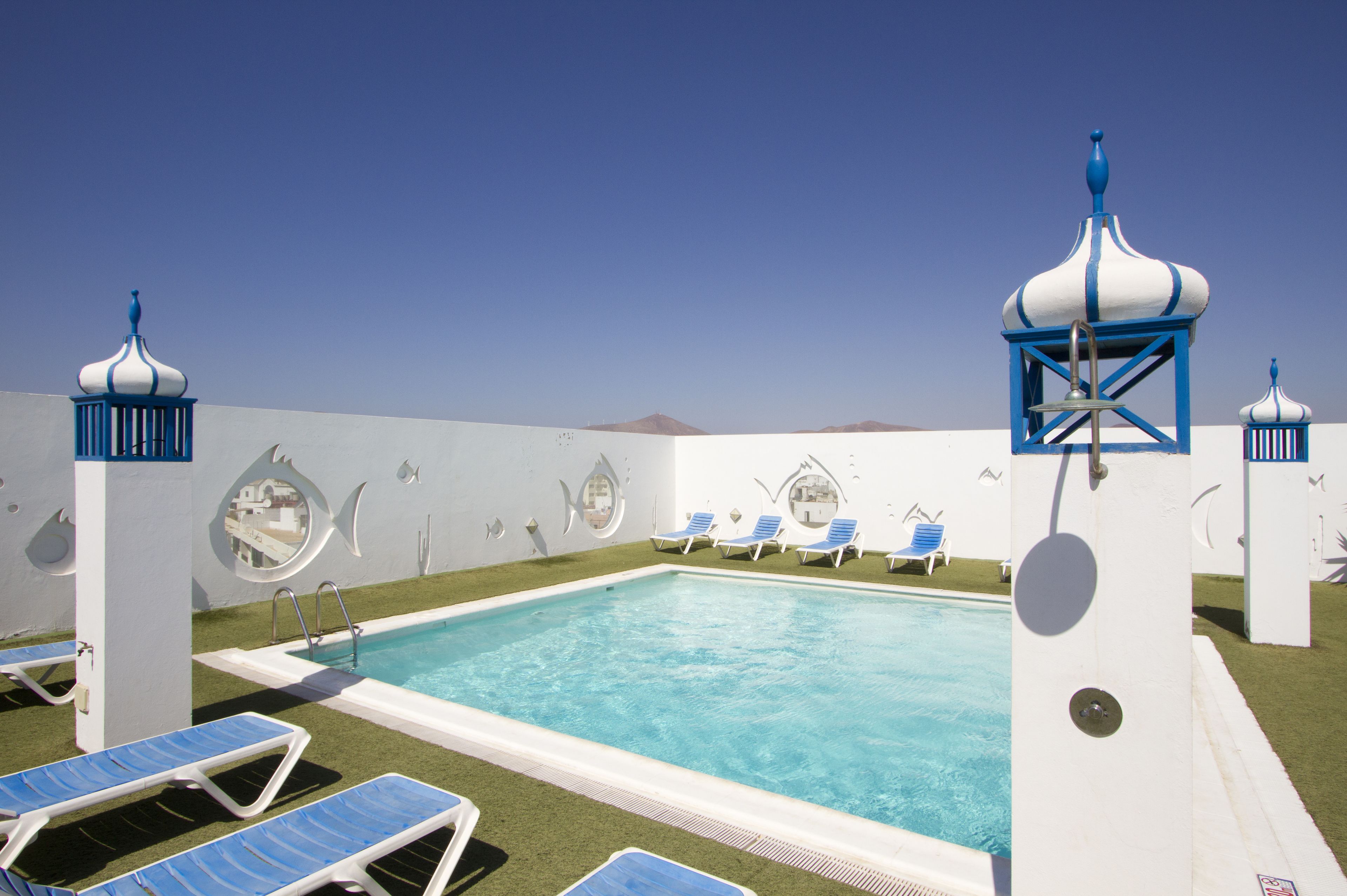 outdoor pool, open 9:00 am to 8:00 pm, pool umbrellas, pool loungers