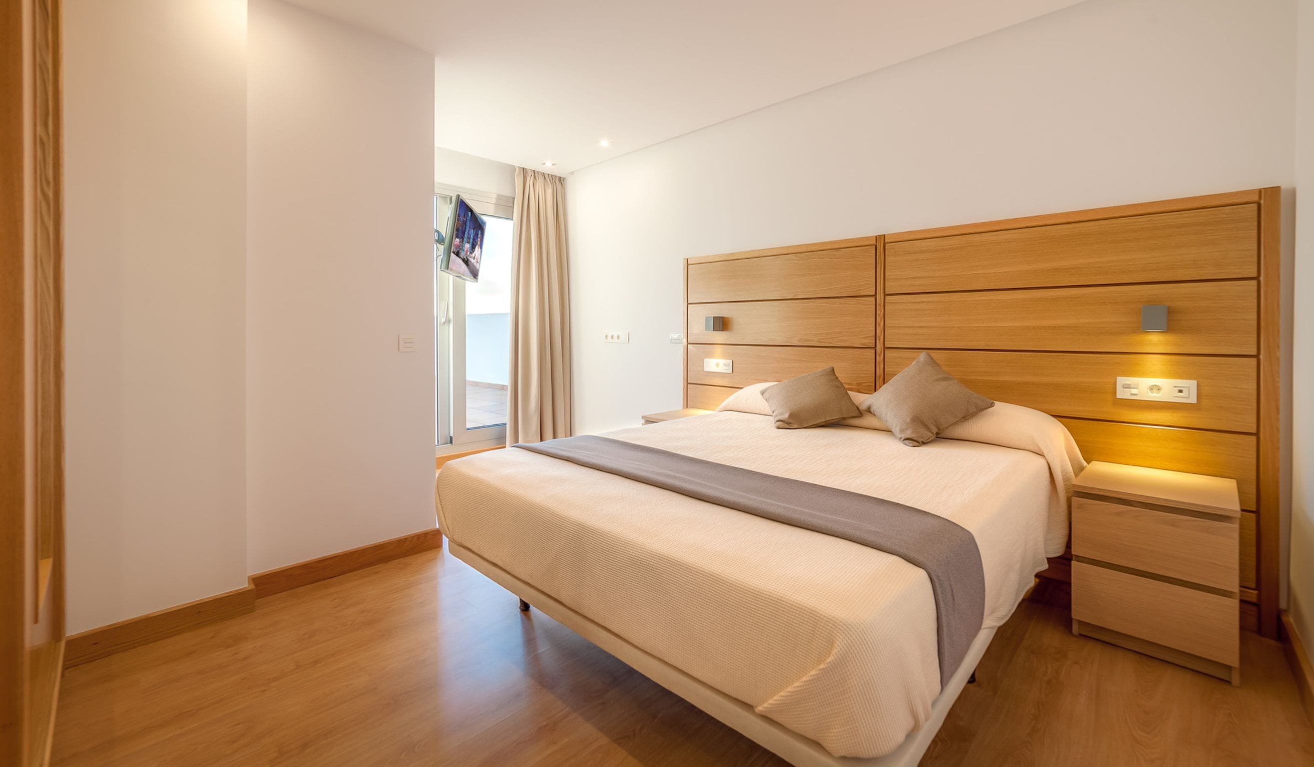 minibar, desk, blackout curtains, iron/ironing board