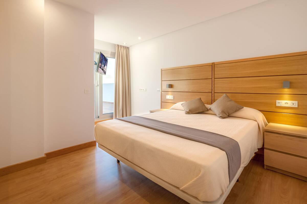 minibar, desk, blackout curtains, iron/ironing board