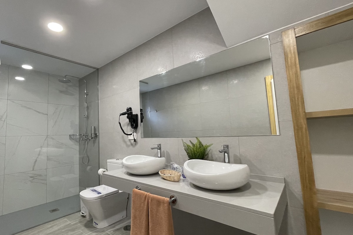 Shower, rainfall showerhead, hair dryer, towels
