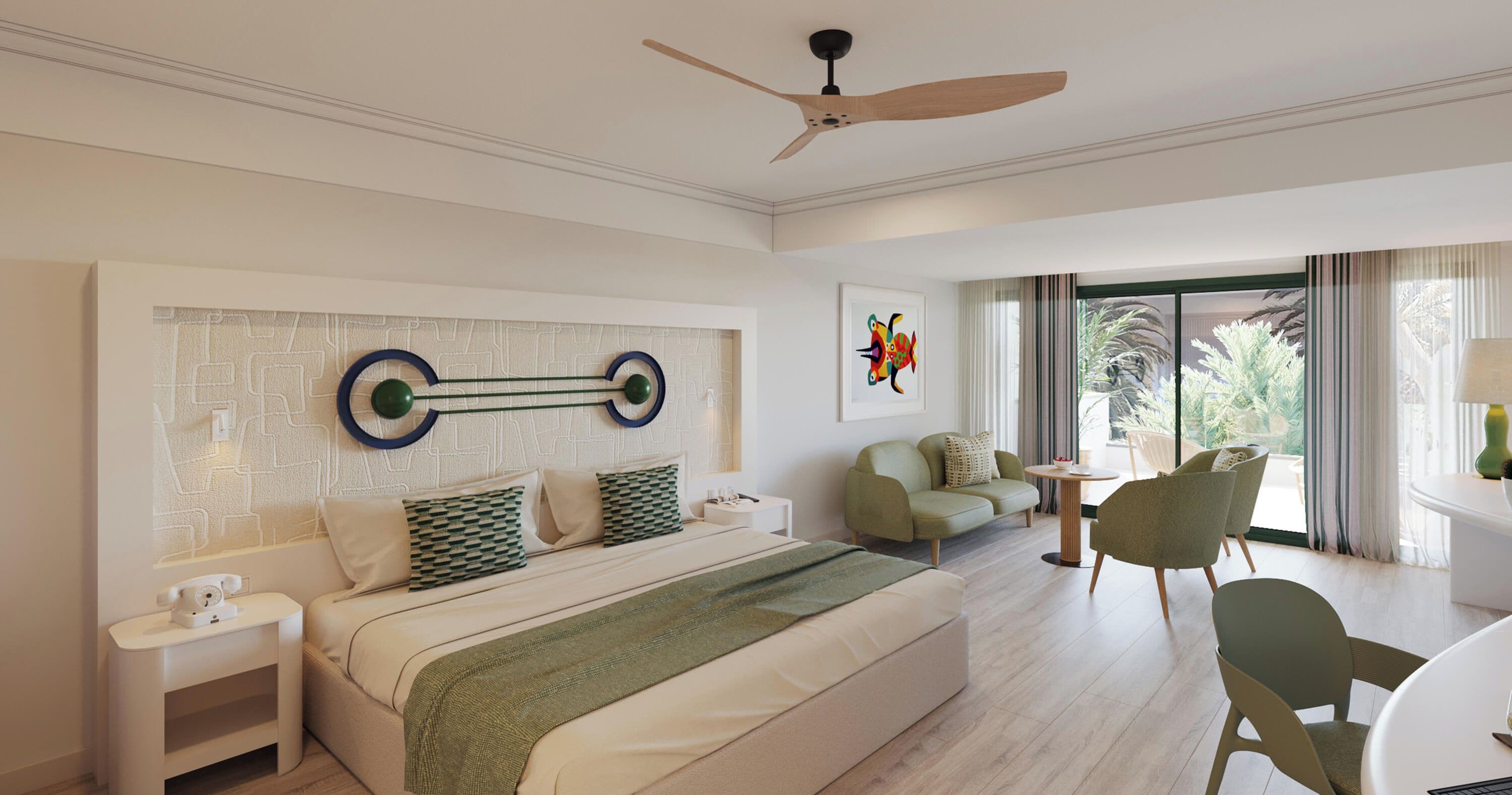 A hotel room with a bed, a desk, a chair, a ceiling fan, and a window with curtains.